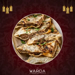 A Plate Of Arayes Featuring Crispy Pitta Bread Stuffed With Seasoned Minced Lamb And Grilled To Perfection.