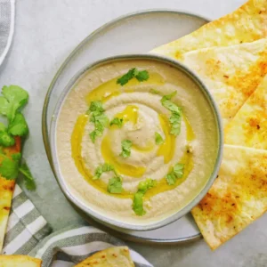 A Bowl Of Baba Ghanoush Made With Grilled Aubergines, Tahini, And Lemon.