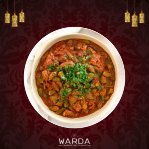 A plate of Bemieh featuring tender okra in tomato sauce, served with fluffy vermicelli rice.