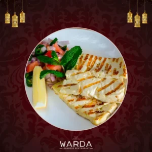 Grilled Halloumi Cheese Slices Served With A Crispy Golden Exterior On A Plate.