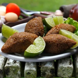 Golden Kibbeh Maklieh Parcels Made With Lamb, Cracked Wheat, And Filled With Onions And Pine Nuts.